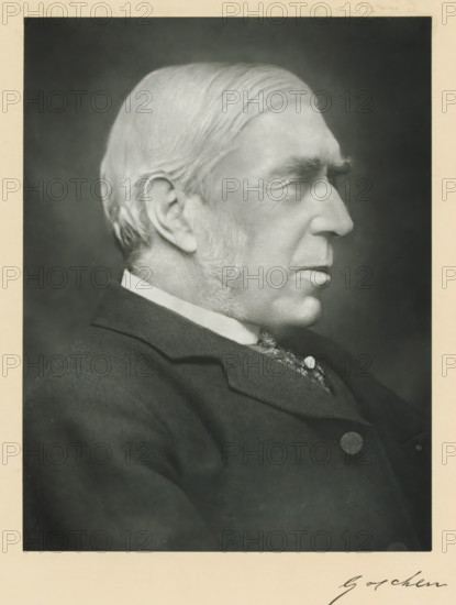The right honorable Viscount Goschen, photograph, page, annotation, inscription: '17, Baker St, London, W.', photographer: Elliott & Fry, c. 1893 - c. 1903, paper, carbon print, height 227 mm x width 171 mm, Person, George Goschen, historical persons (portraits and scenes from the life) ((full) bust portrait), A black and white portrait of an older man in profile facing right, showing a close-up of his head and upper torso; he has neatly combed hair swept back, prominent sideburns, a high forehead with visible wrinkles, a pronounced nose, and a closed mouth with a firm expression; he is wearing a dark suit jacket with a visible collar and a patterned vest underneath, with a round button on the jacket; the background is plain and dark, and the image has a light border surrounding it.
