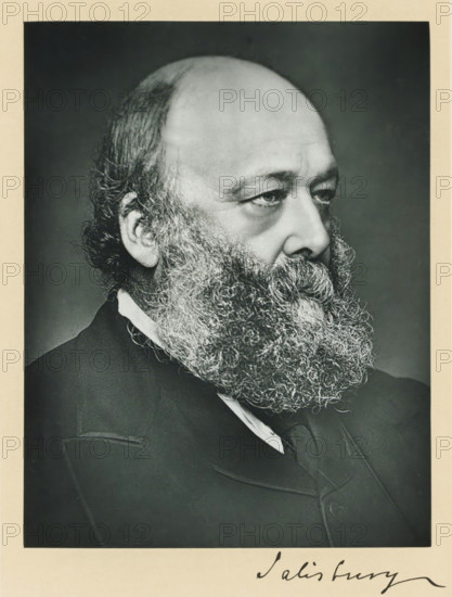 The most noble the marquis of Salisbury, KG, photograph, page, annotation, inscription: '17, Baker St, London, W.', photographer: Russell & Sons, c. 1893 - c. 1903, paper, carbon print, height 227 mm x width 171 mm, Photo on frontispiece., Person, Robert Gascoyne-Cecil (Marquis of Salisbury), historical persons (portraits and scenes from the life) ((full) bust portrait), A black and white portrait of an older man shown in profile from the shoulders up, featuring a high forehead, receding hair at the crown, and thick curly hair at the sides and back of his head; he has a full, dense beard with tight curls that covers his chin and neck, prominent eyebrows, and a thoughtful expression in his eyes; he wears a dark suit jacket with a visible lapel, a white shirt collar, and a dark tie, all set against a plain dark background and surrounded by a light border.