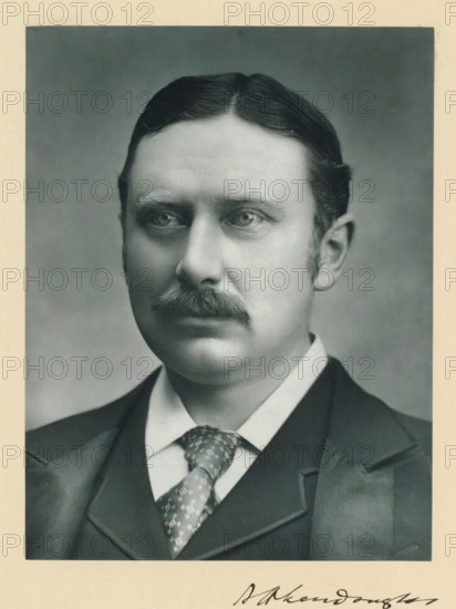 The right honorable Aretas Akers Douglas, photograph, page, inscription: '73, Piccadilly, London, W.', annotation, photographer: John Jabez Edwin Mayall, c. 1893 - c. 1903, paper, carbon print, height 227 mm x width 171 mm, Person, Aretas Akers-Douglas, historical persons (portraits and scenes from the life) ((full) bust portrait), A black-and-white portrait of a man from the shoulders up, showing a neatly combed dark hair with a center part, light eyes, and a trimmed mustache; he is wearing a white shirt with a patterned tie, a dark vest, and a dark jacket with visible lapels, all framed by a light border.