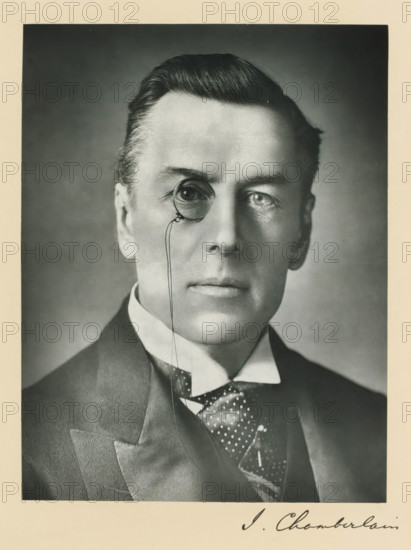 The right honorable Joseph Chamberlain, photograph, page, annotation, inscription: '17, Baker St, London, W.', photographer: Russell & Sons, c. 1893 - c. 1903, paper, carbon print, height 228 mm x width 171 mm, Person, Joseph Chamberlain, historical persons (portraits and scenes from the life) ((full) bust portrait), monocle, single lorgnette, A black-and-white portrait of a man from the shoulders up wearing a dark suit jacket, a high-collared shirt, and a patterned necktie, his hair neatly combed back, his face centered and looking forward, one eye shown through a round monocle attached to a thin cord, the background plain and evenly shaded.