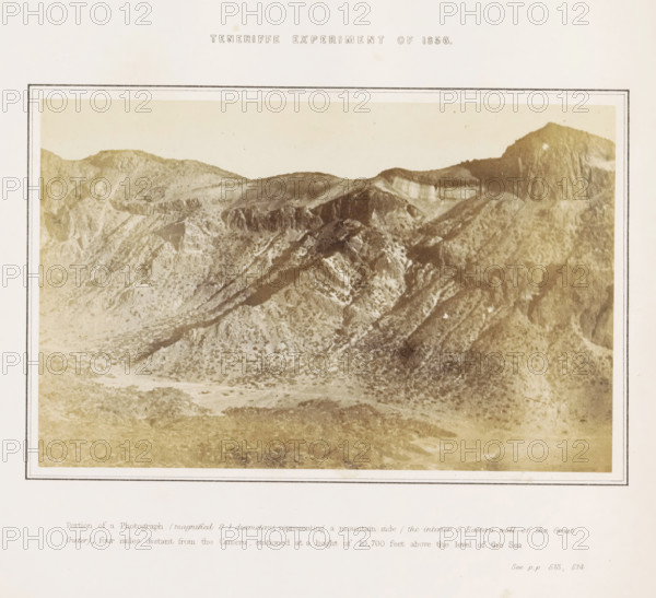 View of the crater of El Teide on Tenerife, Tenerife Experiment of 1856, photograph, page, inscription: 'Portion of a Photograph (magnified 9.1 diameters), representing a mountain side (the interior S. Eastern wall of the Great Crater), four miles distant from the Camera, stationed at a height of 10, 700 feet above the level of the Sea. See pp 513, 514.', number: 'Plate 2.', photographer: Charles Piazzi Smyth, Tenerife, printer (person): JA Spencer (possibly), 1856, printer (person), paper, albumen print, height 127 mm x width 198 mm, Photo in the section at the back., experiment, test, science and technology, volcano, A sepia-toned photograph of a rugged mountainous landscape framed by a double-lined rectangular border on a pale background, showing steep rocky ridges, textured slopes with scattered lighter patches, and a prominent high peak at the right edge; the sky above the mountains is light and mostly clear, and there is a strip of lighter, flatter ground at the bottom within the...