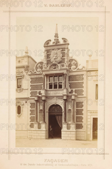 View of a Danish-style façade at the Paris World Exhibition in 1878, designed by Vilhelm Dahlerup, Façaden, photograph, page, inscription: 'til den Danske Industri-afdeling af Verdensudstillingen i Paris 1878.', photographer: Johannes Jaeger, 1878-05-01 - 1878-11-10, paper, albumen print, albumendruk, height 201 mm x width 126 mm, front façade, Wereldtentoonstelling 1878 (Paris), Paris, Period, A sepia-toned photograph of an ornate building facade framed by a pale border, showing a central arched entrance flanked by paired columns with decorative capitals and bases, above which is an elaborate sculpted pediment with scrollwork, circular motifs, and a carved coat of arms set into a patterned brick background; a rectangular window with muntins sits above the entrance within a projecting bay supported by pilasters and intricate molding, while balustrade-like details and small finials decorate the upper sections; the facade combines smooth stone blocks at the lower level with darker textur...