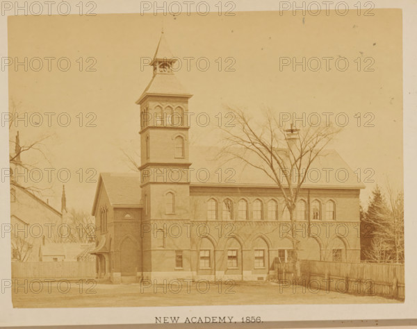 New Academy. 1856, View of the second location of the Friends Academy in New Bedford, Massachusetts, photograph, page, c. 1871 - in or before 1876, photographer, paper, albumen print, height 108 mm x width 145 mm, scholastic education, tuition, civic architecture, edifices, dwellings, North America, New Bedford, A sepia-toned photograph of a multi-story brick building with a tall square tower topped by a steep pyramidal roof and an open belfry, a row of arched windows along the upper floor, and arched entryways on the ground level; leafless trees stand in front of the building, a wooden fence runs along the right side, and a small pitched-roof annex projects from the left side of the main structure.