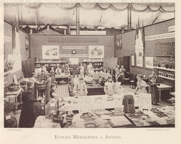 Girls and women in a studio of the domestic science school during the world exhibition in Antwerp, Ecoles Ménagères a Anvers, page, photomechanical print, photographer: Th. Lantin, Antwerp, cliché maker: Joseph Maes, 1894, paper, collotype, light printing, height 161 mm x width 220 mm, scholastic education, tuition, household management, housewife at work, world fair, world exhibition, exhibition, show, A large indoor room under a draped ceiling is filled with children and adults standing and seated at tables and around workstations, many wearing aprons and simple dresses; tables display folded garments, cloth pieces, and small objects, while shelves and a stove line the back wall holding dishes and pots. The back partition walls are decorated with framed pictures and posters, hanging flags, and a chalkboard leaning against a cabinet, with potted plants on a side shelf. Several groups of children are clustered around tubs and tables where they appear to be engaged with the objects on t...