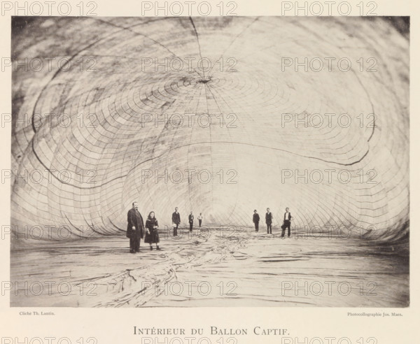 Intérieur du Ballon Captif, People in a tethered balloon during the world exhibition in Antwerp, page, photomechanical print, photographer: Th. Lantin, Antwerp, cliché maker: Joseph Maes, 1894, paper, collotype, photoprint, height 159 mm x width 217 mm, balloon (aviation), world fair, world exhibition, exhibition, show, A large tunnel-like interior with a curved, ribbed surface stretching overhead and inward toward a distant center, the walls marked by concentric arc patterns and subtle shading variations; a textured floor with folds and creases runs toward the center of the space; several people stand along the floor at varying distances from the foreground, wearing long coats and period clothing and facing toward the camera, some holding objects or with hands at their sides, their features and postures visible against the pale interior backdrop.