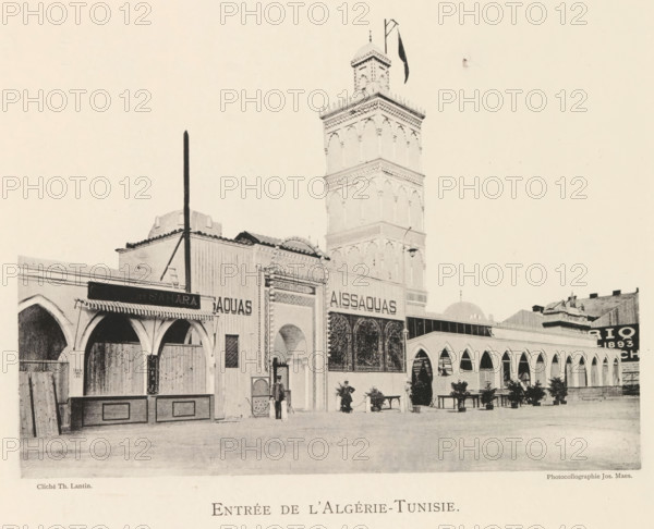 Entrée de l'Algérie-Tunisie, Exterior of the pavilion of Algeria and Tunisia at the world exhibition in Antwerp, page, photomechanical print, photographer: Th. Lantin, Antwerp, printer (person): Joseph Maes, 1894, Th. Lantin, Joseph Maes, photographer, printer (person), paper, collotype, photoprint, height 161 mm x width 219 mm, facade (of house or building), world fair, world exhibition, A sepia-toned street scene shows a row of connected buildings with arched openings and decorative facades, including a tall ornate tower with layered sections and a small dome at the top, a flagpole and a flag near the tower peak, awnings and shutters over some arches, wrought-iron or lattice panels in front of one entrance, potted plants and benches along the building front, a few people standing or walking near the entrances, a vertical pole supported by diagonal stays in front of one building, and varied rooflines and architectural details across the structures.