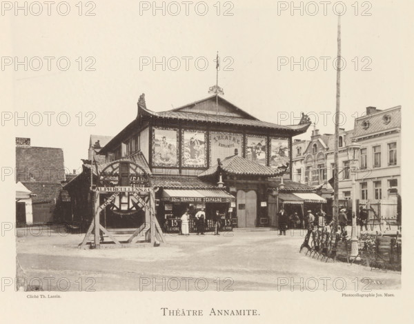 Annamite Theatre, Exterior of the Annamite Theatre at the World Exhibition in Antwerp, page, photomechanical print, photographer: Th. Lantin, Antwerp, printer (person): Joseph Maes, 1894, printer (person), paper, collotype, photogravure, height 161 mm x width 220 mm, façade (of house or building), theatre (building), world fair, world exhibition, A wide street scene centered on a two-story building with a pagoda-style roof featuring ornate upturned eaves and decorative roof tiles, a central entrance with a tiled canopy and carved finials, and large framed panels on the upper façade displaying painted scenes; people stand and walk in front of the building near market stalls and kiosks that have awnings and displayed goods, while to the left a timber structure with a circular wheel-like element stands on a wooden frame; surrounding buildings of varying European architectural styles border the scene with mansard roofs and ornate window surrounds, and a tall slender pole rises near the rig...