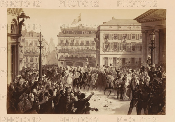 Photo reproduction of a design of the arrival of Léopold II of Belgium at Place de la Monnaie in Brussels during his inauguration on December 17, 1865, Entrée de SM Léopold 11. - le 17 Décembre 1865. Place de la Monnaie, photograph, reproduction, This photo is part of a cover with fourteen photos., photographer: Ghémar Frères, Brussels, after design by anonymous, c. 1861 - in or before 1866, paper, albumen print, albumendruk, height 167 mm x width 250 mm, Person, Leopold II (king of the Belgians), king, ceremonial celebration of installation of a ruler, Period, 1865-12-17, A crowded street scene with a dense throng of people lining both sides of a broad avenue, many reaching or waving toward a group of mounted figures at the center who ride dark and light horses and wear distinctive uniforms and hats; behind the riders a column of foot soldiers holds long poles with hats or banners aloft, and several individuals carry a tall flag; multi-story buildings with rows of windows and balconie...
