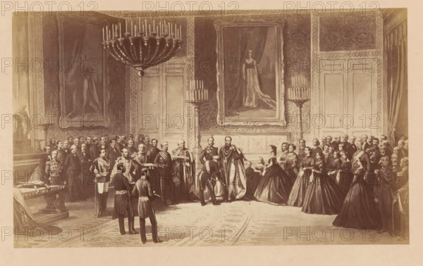 Investiture de l'Ordre de la Jarretière, Photographic reproduction of a design for the inauguration of King Léopold II of Belgium as a member of the Order of the Garter, photograph, reproduction, This photo is part of a cover with fourteen photos., number: '168', annotation: 'Chapter 10., noblesse ..., No 168., Legend: Léopold II is invested in the Order of the Garter. (February 12, 1866)., Photograph by Louis Ghémar.', photographer: Ghémar Frères, Brussels, after design by anonymous, c. 1861 - in or before 1866, Ghémar Frères, photographer, after design by, paper, albumen print, height 169 mm x width 283 mm, Person, Leopold II (king of the Belgians), king, knighthood order (GARTER), Period, 1866, A large formal room with ornate patterned walls and tall doors, a central chandelier hanging from the ceiling, and two large framed portraits mounted on the wall; many people dressed in formal historical clothing stand and kneel across the room, including men in military uniforms and ceremoni...