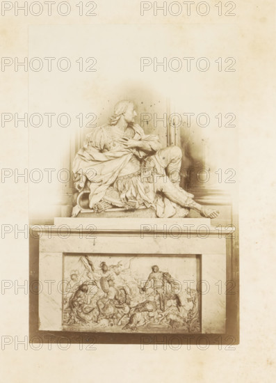 Graphic monument of Frédéric-Maurice de la Tour d'Auvergne, Duke of Bouillon in Cluny, LE MAUSOLÉE DU DUC DE BOUILON (HOSPICE DE CLUNY), photograph, page, photographer: Alfred Boulland, Cluny, c. 1850 - in or before 1872, Alfred Boulland, photographer, paper, pasteboard, albumen print, height 202 mm x width 132 mm, Photo in second part., grave-building, monumental tomb, sculpture (relief, sculpture), A monochrome photograph of a sculpted funerary monument featuring a reclining male figure draped in flowing robes and armor on a raised plinth, the figure turned in profile with one hand across the chest and one leg extended, detailed folds and ornamental elements in the clothing, a helmet and decorative objects near the figure, and a relief panel on the plinth below depicting a dynamic scene of numerous intertwined human and animal figures in varied poses; the image has a soft vignette effect and aged paper texture around the edges.