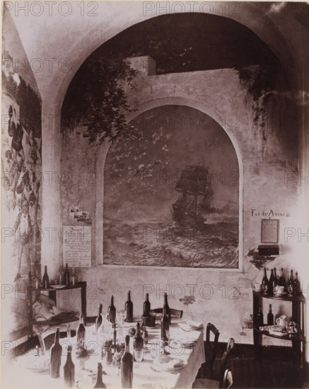 Interior of the dining room of Hotel Pagano in Capri, Italy, Hotel Pagano, Capri, photograph, number: '6126', photographer: attributed to Giorgio Sommer, 1857 - 1915, Attributed to, pasteboard, paper, albumen print, height 250 mm x width 445 mm, hotel, hostelry, inn, Isola di, A dining scene under a high arched ceiling with a large painted mural of a sailing ship set into a recessed arch on the wall, flanked by painted foliage and wall murals, a long table covered with a cloth arranged with empty and partially filled bottles, glassware, plates, folded napkins, and small floral arrangements, chairs pushed around the table, shelving and small tables at the sides holding additional bottles, cups, pitchers, and stacked items, and visible worn plaster and brickwork on the walls.