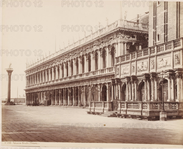 Palazzo Reale. (Venezia), View of the Piazzetta and Palazzo Reale where the Libreria Vecchia is housed, Venice, Italy, photograph, number: 'No. 3511.', inscription: 'II', number: '39', inscription: 'Library in Venice (...)', collector's mark: 'RICH SCHOOL FOR ART HANDBOOK, GROEP', photographer: attributed to Giorgio Sommer, 1857 - 1914, Giorgio Sommer, photographer, Attributed to, pasteboard, paper, albumen print, height 319 mm x width 479 mm, study, 'studiolo', library, square, circus, hôtel, ie small palace in city, Piazzetta, A long ornate stone building with a colonnaded facade and arched openings runs across the image, its upper balustrade lined with standing statues and decorative relief panels, while the lower level shows detailed columns, sculpted doorways, and carved stonework; a tall column topped with a statue stands in the open paved square to the left, and lamp posts and benches are visible along the building, with a large open paved foreground extending toward the viewer.