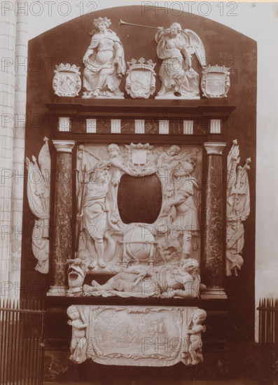 Tomb monument of Cornelis de Witt in the Grote or Sint-Laurenskerk in Rotterdam, photograph, annotation: 'RK St. Laurentius kerk, Grafmonument Witte Corn. de Witt, Aug. 1911, Rotterdam', collector's mark: 'R.MUS.', annotation: 'Lodewijk XIV, 1640-1715', Grote or Sint-Laurenskerk (Rotterdam), 1911, photographer, Rotterdam, Attributed to, paper, pasteboard, daylight collodion silver print, height 219 mm x width 156 mm, Person, Cornelis de Witt, interior of church, grave-building, monumental tomb, A sculptural wall monument set within a dark recessed arch features a pair of seated female figures atop a ledge, one holding a long trumpet and the other with draped robes, flanked by decorative cartouches; below them are columns with marbleized shafts supporting a carved relief scene that includes standing male figures in classical attire, reclining armored figures, cherubic figures, an ornamental shield-shaped panel, and a large spherical object entwined with drapery, with carved draped cloth...
