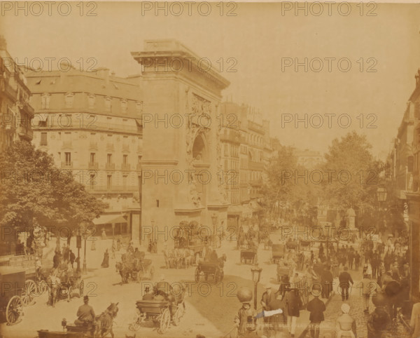 Boulevard St. Denis with the Porte St. Denis, Paris, France, photograph, France., inscription: '228. PARIS. BOULEVARD ST DENIS - LL', check stamp: 'Photography ? Company ?, J.KUHN, PARIS, 220 170174 ? RUE DE RIVOLI', photographer: J. Kuhn, publisher: Léon & Lévy, c. 1865 - c. 1880, pasteboard, paper, albumen print, height 222 mm x width 279 mm, height 304 mm x width 401 mm, A wide street scene with a large stone arch structure at the center left flanked by multi-story buildings with rows of windows and mansard roofs, trees along the street, many horse-drawn carriages and carts on the road, numerous pedestrians on sidewalks and crossing the street wearing period clothing and hats, street lamps and a few awnings over shop entrances visible, and a generally sepia-toned appearance.