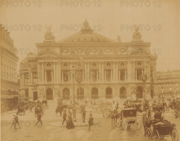 Opéra, Paris, photograph, Paris., inscription: '139 Paris, l'Opéra.', check stamp: 'Photographie Company, J. KUHN, Paris ... Rue de Rivoli ...', photographer: J. Kühn (publisher), c. 1885 - c. 1910, J. Kühn (publisher), photographer, paper, albumen print, height 220 mm, width 275 mm x width 397 mm, height 343 mm, Opéra de Paris, A large ornate stone building with columns and arched openings fills the center of the image, topped by a domed roof and sculpted figures on the roofline; flags hang from poles in front of the façade. In front of the building a busy street scene shows many horse-drawn carriages and people walking, some wearing long coats and hats and a few carrying umbrellas. Lamp posts and decorative sculptural elements are visible near the entrance, and adjacent buildings flank the main structure on either side. The whole scene appears in a single warm, sepia tone.