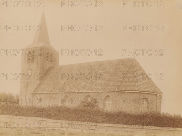 Former Reformed Church in Oosterwierum, photograph, annotation: 'Oosterwierum (Frieschland), NH Church Aug 1902, Baarderadeel', annotation: 'Oosterwierum, Oosterwierum, gem. Baarderadeel', photographer: AJM Mulder (possibly), 1902, Attributed to, paper, pasteboard, albumen print, albumendruk, height 166 mm x width 230 mm, church (exterior), A sepia-toned photograph showing a brick church with a steep tiled roof and a tall square bell tower topped by a pointed spire; the tower has arched openings and a circular feature on its face, and the nave displays arched windows along the side; a low hedge runs in front of the building and a stone wall with a railing is visible in the foreground.