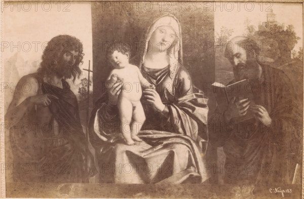 Photo reproduction of painting Madonna with Child and Two Saints by Cima da Conigliano, Academia Venezia, 125 in negative, photograph, photographer: Carlo Naya (possibly), c. 1860 - c. 1880, pasteboard, paper, albumen print, height 228 mm x width 347 mm, picture, painting, Venice, A worn rectangular painting with a central seated woman wearing a draped robe and a hooded veil holding a naked child on her lap; the child stands with one arm raised and the other resting near the woman's hand. To the left of them, a bearded man with long curly hair and a bare shoulder points with one hand and holds a thin staff with the other. To the right, another bearded man with a receding hairline looks downward while holding an open book. The background shows a darker central panel behind the seated woman and lighter areas behind the flanking figures, with faint landscape elements and a small building visible above the right figure. The surface of the painting shows age, discoloration, and spotting, an...
