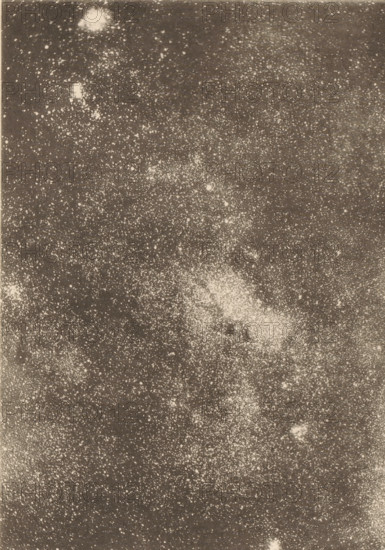 Region of the Milky Way in Sagittarius, Milky Way in the area of the constellation Sagittarius, page, photomechanical print, inscription: 'Showing a double black aperture.', number: 'Plate V.', photographer: Edward Emerson Barnard, cliché maker: anonymous, c. 1890 - in or before 1893, paper, collotype, photoprint, height 148 mm x width 107 mm, Milky Way, A grainy monochrome image filled with numerous small pale speckles and a few larger irregular light patches scattered across a darker background, with dense clusters of speckles forming lighter textured areas and some diffuse, cloudlike bright regions near the top and center.