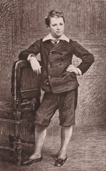 Boetzel, Portrait of Ernest-Philippe Boetzel, page, photomechanical print, photographer: anonymous, cliché maker: Goupil & Cie. (possibly), c. 1871 - in or before 1876, paper, Woodburytype, height 114 mm x width 83 mm, Person, Ernest Boetzel, historical persons, adult man, A charcoal drawing of a young boy standing with one hand resting on the back of a carved wooden chair and the other hand on his hip, wearing a dark double-breasted jacket with a wide white collar, knee-length trousers, and low-heeled shoes. The boy has short hair and a neutral facial expression, and the background is textured with cross-hatched shading. The chair shows carved details and turned legs, and the floor beneath is shaded in the same charcoal style.