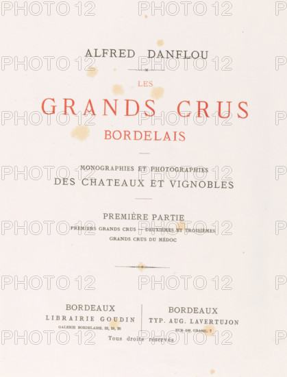 Les grands crûs bordelais : monographies et photographs des châteaux et vignobles, Alfred Danflou, book, date: 'SEPT, 1995', publisher: Librairie Goudin, Bordeaux, printer (person): Auguste Lavertujon, 1867, printer (person), textile materials, pasteboard, biological material, paper, leather, linen (material), printing, combined marbled paper, albumen print, height 357 mm x width 281 mm x thickness 46 mm, The image shows a cream-colored page with scattered pale brown stains and several horizontal ornamental lines; there are large red capital words centered near the top and smaller black lines of text and decorative elements arranged in a formal, symmetrical layout, with two columns of black text toward the lower half separated by a thin vertical divider and more pale brown spots across the page.