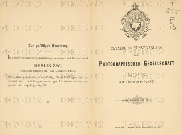 Catalog des Kunstverlags der Photographischen Gesellschaft Berlin 1. October 1883, book, name: 'Henri Hymans, Bruxelles', writer (clerical worker): various manufacturers, printer (person): C. Koepsel, Berlin, 1883, writer (clerical worker), printer (person), paper, albumen print, height 195 mm x width 130 mm x thickness 10 mm, A two-page spread of aged cream paper with a vertical fold down the center, featuring printed decorative elements and a shield-like ornate emblem near the top right with a circular medallion and ornamental flourishes, printed dark ink headings and blocks of smaller printed lines of text across both pages, a small decorative horizontal ornament near the lower center of the right page, a faint handwritten mark along the right edge, and slight creases and spots on the paper surface.