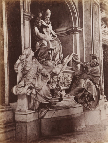 Sculpture of Pope Gregory XIII by Camillo Rusconi St. Peter's Basilica in Vatican City, photograph, page, St. Peter's Basilica, c. 1850 - in or before 1860, photographer, Vatican City, paper, albumen print, height 128 mm x width 97 mm, Person, Gregory XIII, monument, statue, A sepia-toned photograph of a sculptural group set within an arched architectural niche, featuring a seated, robed figure wearing a tall, ornate headdress with one arm raised, flanked by two reclining draped figures on either side; the left figure leans against a scroll-like support and looks upward while holding a tablet, the right figure reaches across toward the seated figure while resting on a rounded shield base; richly textured drapery, carved relief panels, and decorative molding surround the figures, and the scene rests on a stepped stone plinth with visible veining and a patterned floor in front.