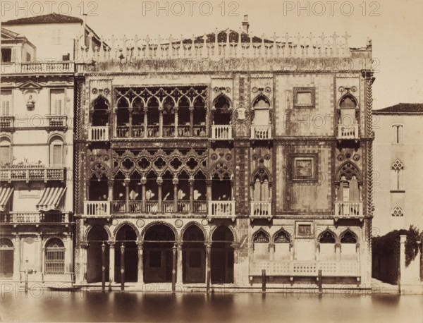 View of the Ca' d'Oro in Venice, photograph, photographer: attributed to Carlo Naya, c. 1880 - c. 1900, Attributed to, paper, pasteboard, albumen print, height 271 mm x width 356 mm, height 500 mm x width 650 mm, Venice, Ca' d'Oro, A wide stone facade with ornate gothic windows and arched loggias rises above a calm water canal, showing multiple tiers of columns and carved tracery, decorative circular motifs, carved shields, and small balconies with balustrades; adjacent palazzo sections display shuttered windows, striped awnings, and a sculpted medallion on a pale wall, while the roofline is edged with sculpted pinnacles and a tiled roof visible behind them, and wooden mooring posts stand in the water in front of the building.