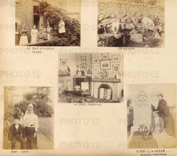 Various subjects, album page, photograph, Group portrait at a house at 45 Rue d'Elbeuf in Rouen, a woman at a well in Criccieth, a portrait of a boy and a woman, the interior of the bedroom of M. Ord and two women, S. Ord and GA Fryer, at the grave of Maria Ord. This page is part of an album., Europe, 1891-02-21 - in or before 1897, photographer, paper, albumen print, height 238 mm x width 275 mm, Person, Maria Ord, S. Ord, GA Fryer, historical persons, adult woman, bedroom, child, laying flowers or wreath on grave, Rouen, North Wales, Wales, Gwynedd, Criccieth, A large pale page with several sepia photographs mounted on it, showing at the top left a group of women and girls standing on a low stone ledge beside a brick building and leafy vines, at the top right a rocky outdoor scene with a woman near a stone trough and a large round millstone, in the center a furnished room with a fireplace, framed pictures on the wall, a small table with flowers and decorative objects on the mantle, a...