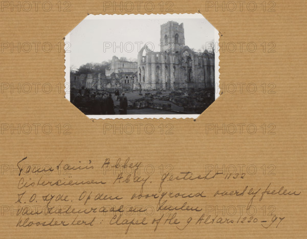 England. Fountains Abbey., photograph, 1880 - 1920, photographer, paper, gelatin silver print, developing gelatin silver print, height 60 mm x width 80 mm, height 250 mm x width 200 mm, Yorkshire, Studley Royal Park, Fountains Abbey, A black and white photograph with scalloped white edges is mounted on corrugated brown paper; the photograph shows stone ruins of a large Gothic-style abbey with tall arches and a central tower, leafless trees visible behind the structure, scattered low stone walls and rubble in the foreground, and a group of people dressed in dark clothing standing near the ruins.