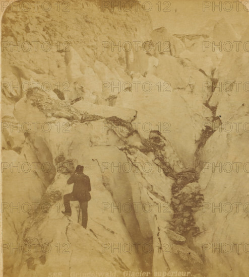 View of a pass in the High Grindelwald Glacier, Switzerland, Grindelwald : Glacier superior, Views and landscapes in Europe, Africa and Asia, Geographical Sculpture Gallery, collected by MJ Broekhuijsen, Head of a school in Amsterdam, stereograph, Numbered 588 in the lower left of the photo., annotation: 'Grindelwald is a high valley between the Bernese Alps and the Faulhorn mountain range, traversed by the Black Lutschine, +, - 1000 M. above sea level, with an upper and lower glacier., The image clearly shows us how dangerous climbing a glacier can be.', publisher: Merkelbach & Co., Amsterdam, compiler (person in literature): Martien Johan Broekhuijsen, c. 1905, photographer, compiler (person in literature), pasteboard, paper, albumen print, height 88 mm x width 177 mm, Part of a group of 52 stereophotos used in primary education as a supplement to school charts. The entire series consisted of 274 items in 10 categories (A to K)., glacier, mountain climbing, mountaineering, High Grind...