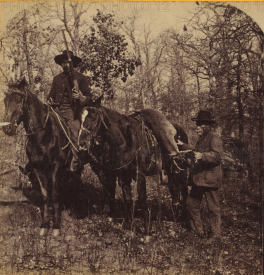 In the Boschveld, Two men on horseback with a shot hartebeest in South Africa, Faces and landscapes in Europe, Africa and Asia, Geographical Sculpture Gallery, collected by MJ Broekhuijsen, Headmaster of a school in Amsterdam, stereograph, annotation: 'One should not look for impenetrable forests here. The trees stand nowhere close together. Thorn bushes everywhere. The two Boers have shot a hartebeest and are bringing the prize 'home'. One can see from the horses that they have not yet been in war: they still gleam!', South Africa, publisher: Merkelbach & Co., Amsterdam, compiler (person in literature): Martien Johan Broekhuijsen, c. 1905, photographer, compiler (person in literature), pasteboard, paper, albumen print, height 86 mm x width 177 mm, Part of a group of 52 stereophotos used in primary education as a supplement to school charts. The entire series consisted of 274 items in 10 categories (A to K)., historical persons not known by name, hunt, hoofed animals (hunting with hors...