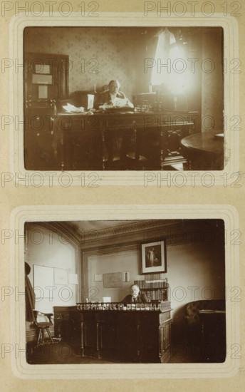 Portrait of a man reading behind a desk in a room in Germany, photograph, Part of Photo album of Carl Heinrich Fliegenschmidt, prison director at Oslebshausen., Germany, c. 1890 - c. 1910, photographer, pasteboard, paper, daylight collodion silver print, height 78 mm x width 110 mm, adult man, writing-table, writing-desk, reading, A sepia-toned photograph shows two framed scenes stacked vertically on a textured background. In the upper scene a person sits behind a large wooden desk cluttered with papers and objects, light streaming through a curtained window to the right and casting a bright area on the wall; patterned wallpaper, a door with notices affixed, and a round side table are visible around the desk. In the lower scene another person sits behind an ornate wooden desk with decorative railing, a tall bookshelf behind them, framed artwork on the wall, a chair to the left and a cushioned armchair to the right, all within a room featuring molded ceiling details and paneled walls.