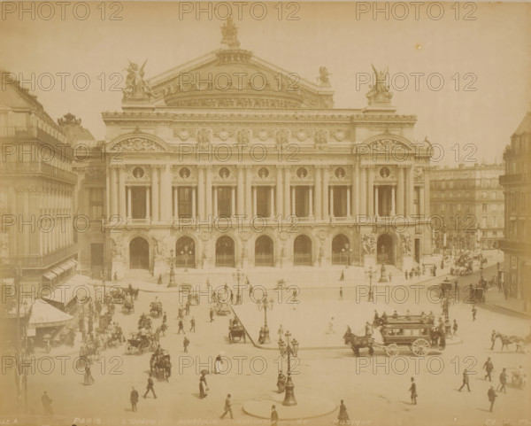 View of the Opéra Garnier in Paris, PARIS L'Opéra, Académie Nationale de Musique, photograph, Part of Travel album with recordings of sights in Sweden, Norway, Denmark, Bavaria, Milan and Paris., number: '445.A', photographer: H, Paris, c. 1870 - c. 1890, H, photographer, paper, albumen print, albumendruk, height 219 mm x width 275 mm, opera house, Opéra de Paris, A wide sepia photograph of a classical stone building with a large central dome and ornate sculptures along the roofline, flanked by symmetrical facades with tall columns and arched openings; the facade features decorative reliefs and circular medallions above the windows, and statues stand in niches near the entrance arches. In front of the building is a broad open plaza with multiple ornate street lamps and scattered groups of pedestrians walking or standing, some carrying umbrellas, and several horse-drawn carriages and carts moving across the square. Buildings with uniform facades and balconies line the sides of the plaza...