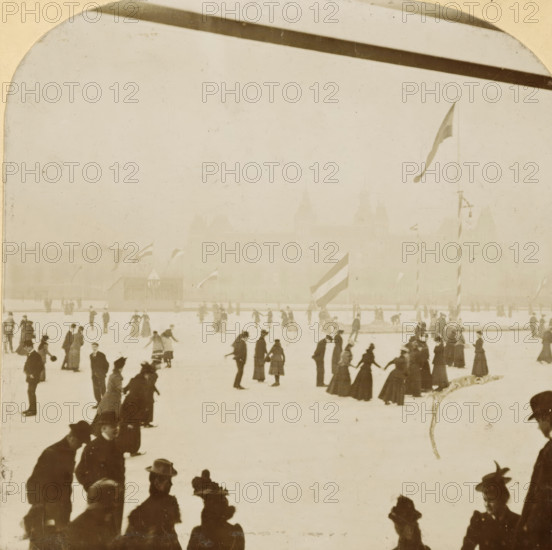 The Skating Rink of the Amsterdam Ice Club behind the Rijksmuseum, stereograph, number: '1.50', photographer: AC Bruyn, Amsterdam, 1901-01, paper, pasteboard, baryta paper, daylight gelatin silver print, height 81 mm x width 162 mm, height 88 mm x width 178 mm, skates (winter sports), flag, skating, Museumplein, A sepia-toned scene showing many people ice skating on a frozen surface, with figures dressed in long coats and hats, some holding hands and others skating individually, a few clustered near the foreground edges, and a tall flag on a pole rising above the surface with other smaller flags visible further back.