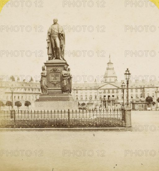 Carlsruhe (Grand-Duche de Bade), Statue du grand-duc Frederic et Chateau, Statue of Grand Duke Charles Frederick of Baden in Karlsruhe, Germany, Allemagne, stereograph, number: 'N. 337', photographer: Hippolyte Jouvin, Baden-Baden, after sculpture by Ludwig von Schwanthaler, 1860 - 1865, Ludwig von Schwanthaler, after sculpture by, Baden-Württemberg, pasteboard, paper, albumen print, albumendruk, height 75 mm x width 150 mm, Person, Grand Duke of Baden Frederick, monument, statue, square, circus, Karlsruhe, A tall stone statue of a standing man wearing a cloak and formal attire stands on a decorated plinth flanked by two sculpted female figures, all set behind an ornate metal fence; in the background there is a large classical building with a domed central tower and rows of windows, a few street lamps with decorative tops, and a line of small trees along the building facade.