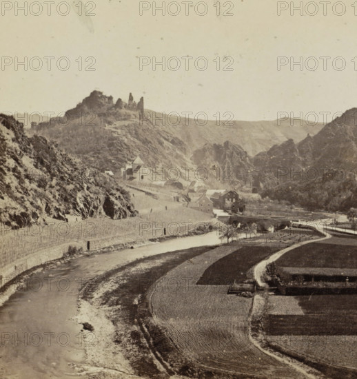 Altenahr and Ahrthal, View of Altenahr and Burg Are in the Ahr Valley, Germany, Bords du Rin, stereograph, inscription: 'CREUZNACH.', photographer: Carl Heinrich Jacobi, Altenahr, 1852 - 1868, Rhineland-Palatinate, pasteboard, paper, albumen print, height 86 mm x width 175 mm, landscape with ruins, village, dale, valley, Burg Are, A sepia-toned landscape showing a winding river bordered by plowed fields and a curving road, with a stone bridge crossing the river near a cluster of buildings including a church with a pitched roof, perched at the base of steep rocky hills and cliffs; rugged slopes rise on both sides with rocky outcrops and a ruined stone structure atop one ridge, scattered small trees near the water, and textured cloudless sky above.