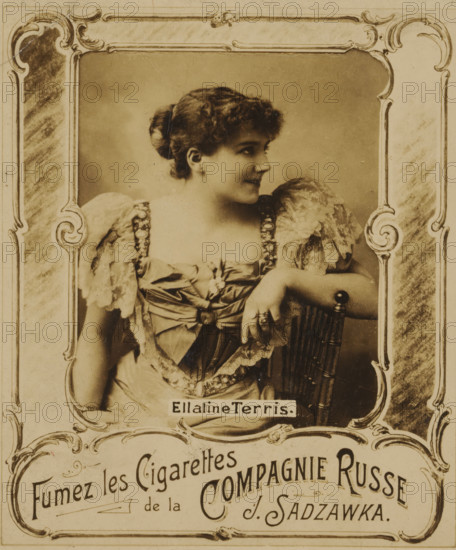 Portrait of Ellaline Terris, advertisement for Cigarettes Compagnie Russe J. Sadzawka, Ellaline Terris, photograph, inscription: 'Fumez les Cigarettes, de la, COMPAGNIE RUSSE, J. SADZAWKA.', 1895 - 1910, photographer, paper, gelatin silver print, developing gelatin silver print, height 69 mm x width 59 mm, Such photos were known as 'black ones'. They were obtained when purchasing certain brands of tea, cocoa, cigarettes, rusk, etc. for collection. There were collection albums specially produced for the 'black people' in circulation., Person, Ellaline Terriss, historical persons - BB - woman, advertisement, A sepia-toned portrait of a woman seated and shown from the waist up within an ornate decorative border, wearing a dress with puffed lace sleeves and a ribboned bodice, her hair styled in an updo with curls at the front, her face turned in profile to the right and resting an arm on the back of a wooden chair, a ring visible on a finger and lace trim on the dress, with a soft plain ba...