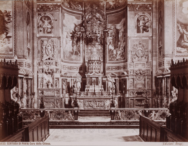 Coro della Chiesa, Interior of the Certosa di Pavia, seen towards the choir, Pavia, Italy, Certosa di Pavia, photograph, number: '1633.', number: '13', publisher: Giacomo Brogi, Florence, 1856 - 1881, photographer, Tuscany, Lombardy, pasteboard, paper, albumen print, height 304 mm x width 404 mm, parts of church interior: choir, A wide interior view of an ornate church choir area dominated by a richly decorated altar and backdrop, with carved stone and sculpted figures, relief panels, and architectural moldings covering the walls; tall painted panels and frescoes depicting human figures and angelic forms flank the central dome-like structure above the altar, while intricately carved balustrades, ornate benches, and wooden pews frame the foreground; sculpted cherubs and ornamental motifs appear along the lower railing and supports, and decorative columns, pilasters, and niches filled with statues rise on either side, all rendered in a monochrome sepia tone.