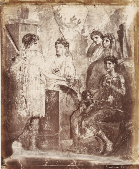 Photo reproduction of a fresco in Pompeii, Peinture Pompei, photograph, reproduction, number: '78.', number: '11', Pompeii, after painting by anonymous, 1851 - 1900, photographer, pasteboard, paper, albumen print, albumendruk, height 400 mm x width 304 mm, wall covering, A faded mural panel shows several figures in classical attire arranged in a scene set against a textured background with leafy motifs and architectural elements; on the left a standing figure faces a seated figure draped in robes, their hands extended toward each other, while to the right a group of three figures stands and sits, two of them wearing wreaths and one seated with hands raised in a gesture, a small winged childlike figure near the seated person looks upward, and at the bottom a partially visible figure kneels with legs bent and feet in sandals, all rendered in worn monochrome tones with visible cracks and areas of surface loss.
