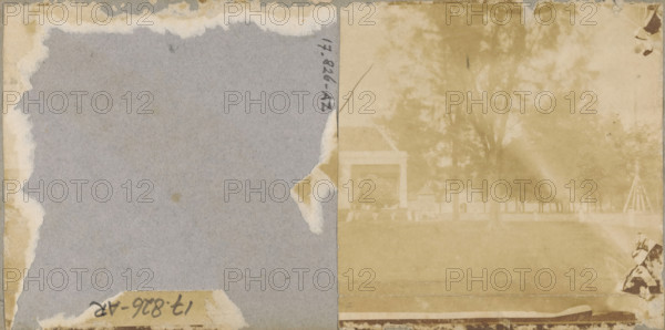 Park with building, stereograph, Originally this object was a stereophoto, but the left photo has been torn off., 1857 - 1870, photographer, pasteboard, paper, albumen print, height 85 mm x width 83 mm, park, A faded two-toned image divided vertically shows a left side of worn gray paper with torn beige edges and a small torn patch near the outer middle, and a right side of a sepia-toned photograph with a faint view of trees, a lawn, and a building with a columned porch structure partially visible through the haze, while a small section of patterned material or fabric appears in the lower right corner and several spots and stains are scattered across the surface.