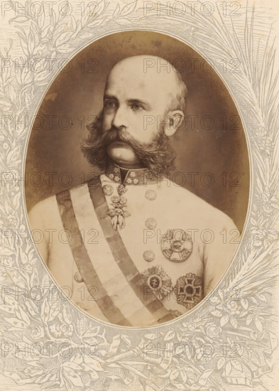 Photo reproduction of a painted portrait of Franz Joseph I, Emperor of Austria and King of Hungary, Franz Joseph I, Kaiser von Oesterreich, König von Ungarn, photograph, reproduction, page, after painting by anonymous, c. 1875 - in or before 1880, photographer, paper, albumen print, albumendruk, height 189 mm x width 143 mm, Photo on unnumbered page., Person, Franz Joseph I Karl (Emperor of Austria), historical persons, emperor, A sepia-toned portrait of a man shown from the chest up inside an oval frame, with a bald head and thick, curled sideburns and mustache, wearing a light-colored military uniform decorated with a sash across the chest and several ornate medals and badges, a high collar with decorative elements, and a neutral expression while looking slightly to the side, the oval portrait set against an illustrated floral and leafy border.