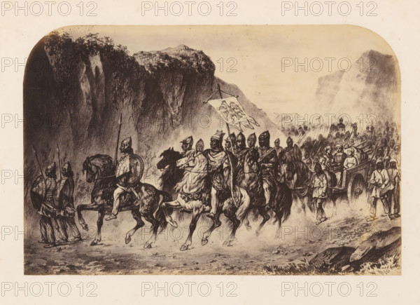 Photo reproduction of a print of Attila and the Huns, photograph, reproduction, page, photographer: Willem Adrianus van Hoek, after print by anonymous, c. 1856 - in or before 1861, after print by, paper, albumen print, height 138 mm x width 210 mm, Person, Attila the Hun, army 'en route', A sepia-toned illustration shows a procession of mounted warriors and foot soldiers moving along a rocky path beneath towering cliffs and vegetation. Several riders wear helmets and hold spears or shields, and one rider carries a large banner with a decorative design. Horses are depicted in motion, their legs raised as they walk or trot, and some riders wear cloaks or patterned garments. Behind the mounted group, a crowd of infantry advances carrying spears and standards, while a cart drawn by animals carries seated figures and is accompanied by attendants on foot. The background features steep, shadowed rock faces and distant rugged mountains under a pale sky.