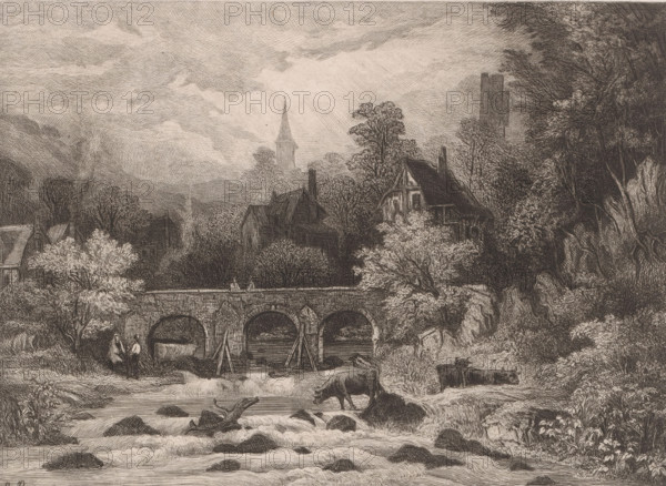 Landscape with village in a mountain valley along a river with bridge, print, printmaker: Auguste Numans, printer (person): Joseph Bouwens, Brussels, 1833 - 1879, printer (person), paper, chine collé, etching, intaglio printmaking technique, roulette, height 198 mm x width 275 mm, prospect of village, silhouette of village, bridge in village across river, canal, cow, river (landscape with figures, staffage), A detailed monochrome engraving showing a river in the foreground with flowing water, rocks, and a submerged log, a cow standing on the near bank, and vegetation along the shores; behind the river is a stone bridge with arches and wooden braces, two small human figures walking near the bridge, and clustered buildings and houses partially obscured by trees; further back are tall trees and a church spire rising above the foliage, with clouds filling much of the sky and dense tree cover framing the scene on the right.