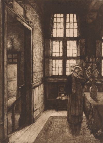 Lady in an interior arranging flowers, print, mark: 'Antwerpsche Etsers 1880', printmaker: Léon Brunin, 1886, paper, etching, intaglio printmaking technique, height 360 mm x width 239 mm, interior of the house, flowers in a vase, A dimly lit interior rendered in fine linework showing a narrow entry area with wooden paneling and a patterned rug along the floor, a tall multi-paned window casting light into the space, a doorway opening into another room, and a figure standing near a table holding a vessel of flowers; the figure wears a long coat and a head covering and appears to hold a small object near a piece of furniture beside the window, while a carved mantel and decorative objects sit near the window and the table is draped with a cloth.
