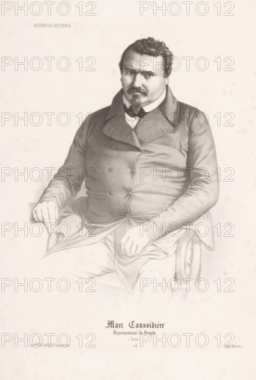 Portrait of Marc Caussidière, Marc Caussidière, Portraits of members of the National Assembly, Assemblée Nationale, print, Series number, 24, printmaker: Alexandre Lacauchie, printer (person): Jean-Baptiste Bazile Domnec, Paris, publisher: Delarue & Cie., Victor, 1848 - 1849, printer (person), paper, lithography, height 376 mm x width 243 mm, Person, historical persons, A seated man depicted in a detailed pencil or charcoal drawing wearing a dark double-breasted coat with wide lapels and a high-collared shirt, with a bow or cravat at the neck, short curly hair, a mustache and pointed goatee, one hand resting on his thigh and the other holding the edge of a draped fabric on his lap, the arm of a carved wooden chair visible under his right forearm, the portrait centered on a pale, slightly speckled background with faint tonal shading and subtle age spots.