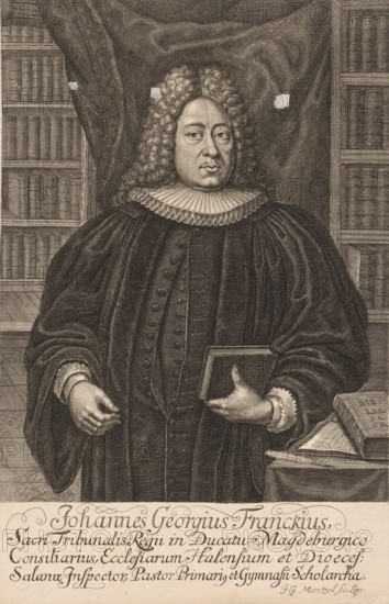 Portrait of Johannes Georgius Franckius, print, printmaker: Johann Georg Mentzel, Leipzig, 1687 - 1743, Saxony, paper, engraving, height 281 mm x width 182 mm, Person, Franckius, Johannes Georgius, historical persons, the Bible as a book, theologian, wig, book, bookshelves, A monochrome engraved portrait of a man shown from the waist up wearing a dark robe with wide sleeves and a pleated white ruff around his neck, his hair arranged in long, curled locks framing his face, one hand holding a closed book against his torso while the other hand is slightly extended, bookshelves filled with uniformly bound volumes visible behind him on both sides, a draped fabric backdrop behind his head, and a table with stacked open and closed books at his side.
