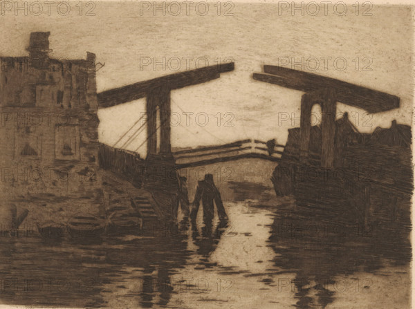 Drawbridge at the Zandhoek in Amsterdam, print, signature: 'Willem Witsen', printmaker: Willem Witsen (signed by artist), Amsterdam, c. 1887, paper, etching, intaglio printmaking technique, aquatint, height 179 mm x width 240 mm, rowing-boat, canoe, housing, drawbridge, fortified city, Zandhoek, A sepia-toned scene rendered with etched lines shows a narrow waterway flanked by dark, textured buildings and wooden structures. Two vertical supports rise from the banks, each topped by a long horizontal beam that extends toward the center, with rail-like planks spanning between them. In the foreground a pair of human silhouettes stand in the shallow water, their reflections stretching below them. On the left bank there are stacked round shapes and a small boat near the edge, and a multi-story facade with rectangular window openings. On the right bank a darker mass of rooflines and structural details contrasts with the lighter sky and distant horizon. The sky is pale and largely unmarked, and...
