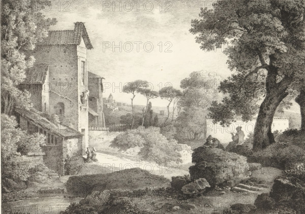 Landscape with clergymen, Series of lithographs, Receuil de dessins sur pierre, print, album page, Print is part of an album., printmaker: Claude Thiénon, 1818 - 1819, paper, lithography, height 296 mm x width 439 mm, city view, and landscape with man-made constructions, monks and nuns, A detailed monochrome landscape shows a stone building with a tiled roof on the left, surrounded by trees and foliage, with a narrow path leading past it; tall, slender trees with rounded canopies rise toward the center, and rolling vegetation and bushes fill the middle ground; on the right a large, gnarled tree with dense leaves stands above a rocky outcrop where a seated figure appears to be holding something, while further right a low wall or structure is partially visible behind the tree; the foreground includes rocks and textured ground, and the distant background fades into a light sky with subtle cloud texture.