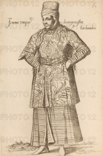 Turkish chambermaid, Femme turque de moyen estat En chambre, print, album page, book illustration, Print is part of an album., printmaker: Léon Davent, after drawing by Luca Penni (attributed to), after drawing by Nicolas de Nicolay (possibly), publisher: Guillaume Rouille (I), Lyon, 1555 - 1568, Attributed to, paper, etching, pasted on album page, height 263 mm x width 174 mm, A standing figure facing slightly to the side wearing a tall wrapped headpiece and a scarf tied under the chin, with long hair or hairlike strands falling over the shoulders; the figure wears a patterned long overgarment with floral and ornate swirling designs, a belted waist, and sleeves that appear layered with patterned cuffs, hands resting on the hips; below that a striped skirt with vertical and horizontal lines is visible over shoes with pointed toes, and the ground shows some grasslike texture.