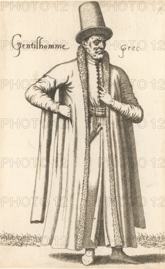 Gentilhomme Grec, Greek man, print, album page, book illustration, Print is part of an album., printmaker: Léon Davent, after drawing by Luca Penni (attributed to), after drawing by Nicolas de Nicolay (possibly), publisher: Guillaume Rouille (I), Lyon, 1555 - 1568, Léon Davet, Attributed to, paper, etching, mounted on album page, height 270 mm x width 169 mm, A tall man stands facing slightly to the side, wearing a long cloak with a fur-trimmed front and full, draping folds, a fitted long-sleeved garment beneath, and a high cylindrical hat. His facial hair includes a mustache and a small beard, and his expression appears neutral as he looks outward. One hand rests on his hip beneath the cloak while the other hand is raised to his chest, fingers extended toward the neckline. A belted waist with decorative elements and a sheathed dagger are visible beneath the fur trim. The image is a monochrome line engraving with fine crosshatching and shading, and a simple ground with tufts of grass a...